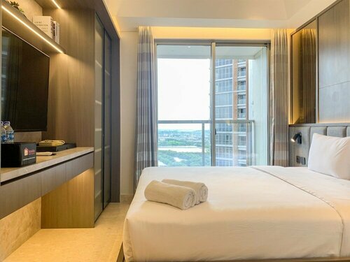 Апартаменты Minimalist And Nice Studio At Gold Coast Apartment в Джакарте