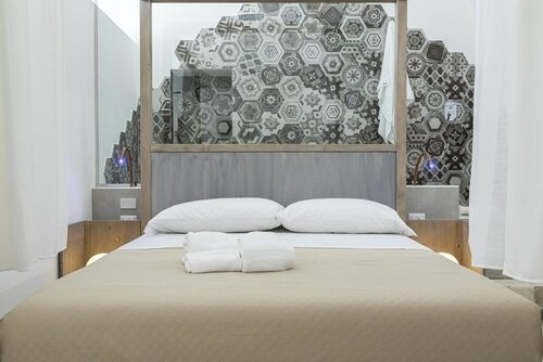 Гостиница Corte Rovito Rooms & Suites в Удженто