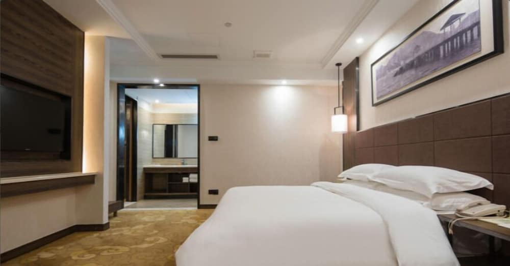 Фото Auden International Hotel