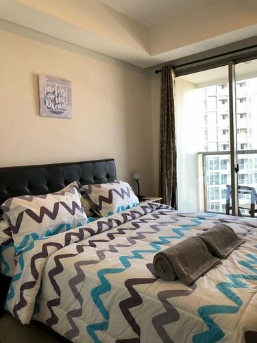 Гостиница Modern Look And Warm 1Br At Gold Coast Apartment