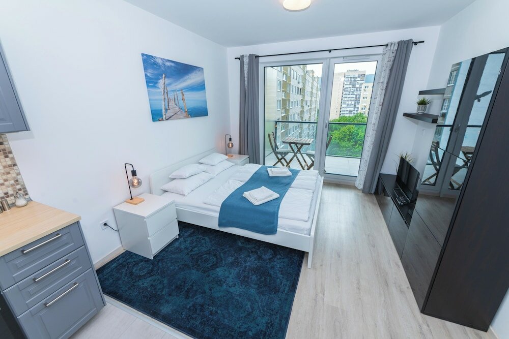 Фото WaterFront City Apartments by UrbanRent