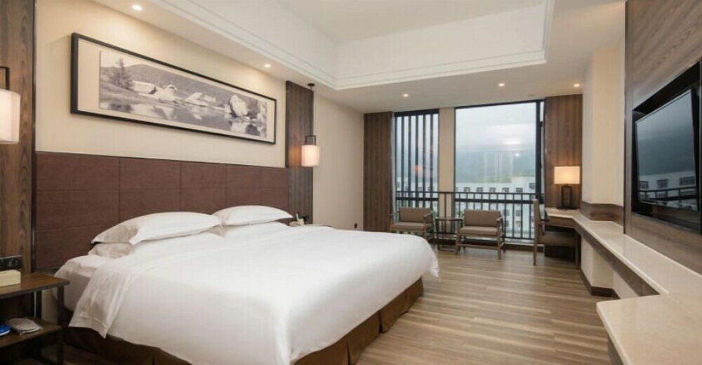 Фото Auden International Hotel