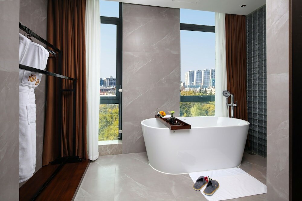 Фото Tiegang Jinjiangduchengjiudian