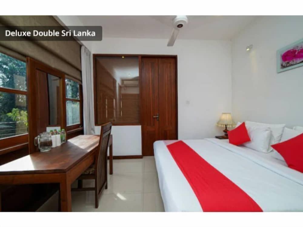 Фото Oyo 557 De Mansion