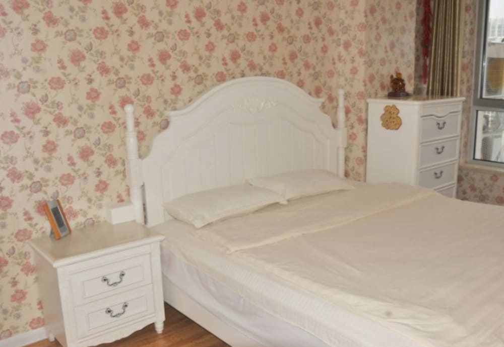 Фото Dalian Xiuzhu Building Apartment