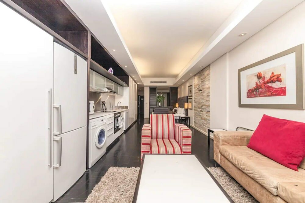 Фото Warm and Modern 1bd Apt in Cbd