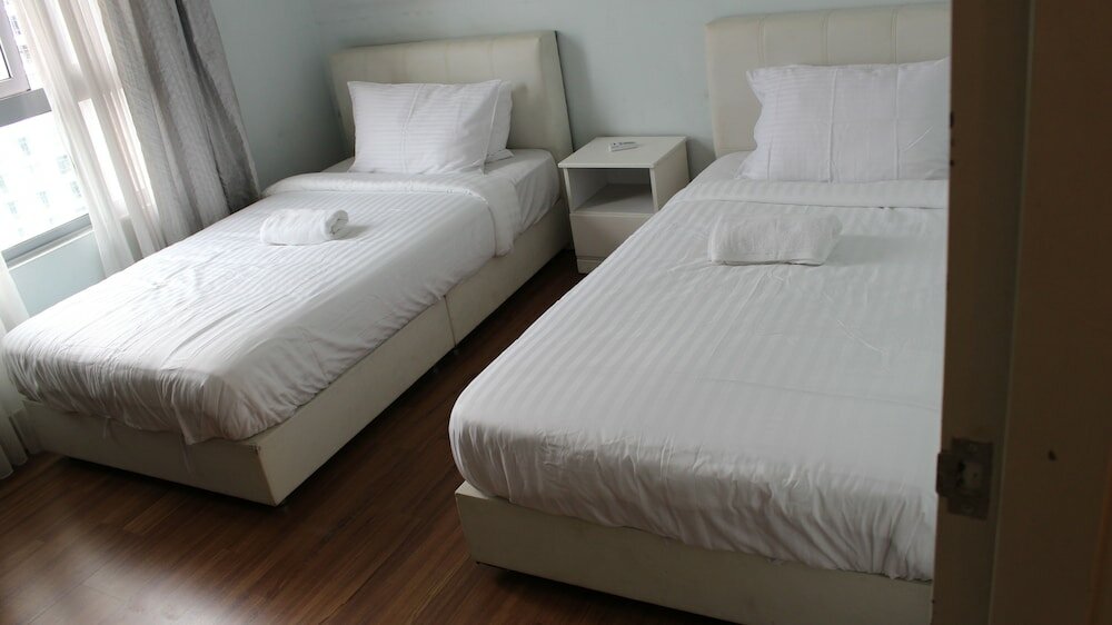 Фото Peaceful Service Suites at Taragon Puteri Bintang