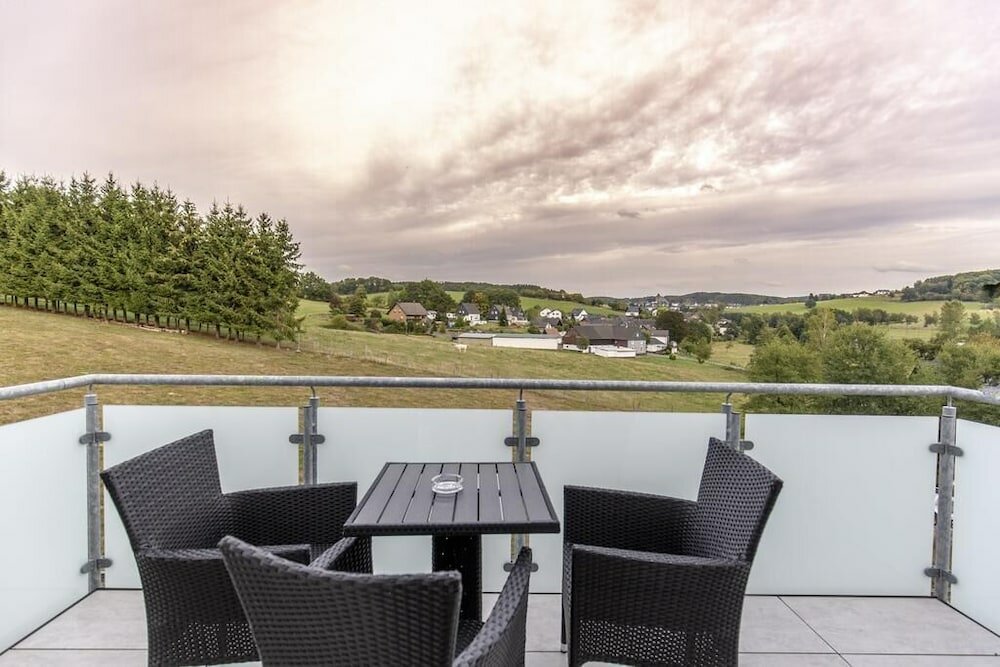 Фото Ferienwohnungen Am Mühlenberg