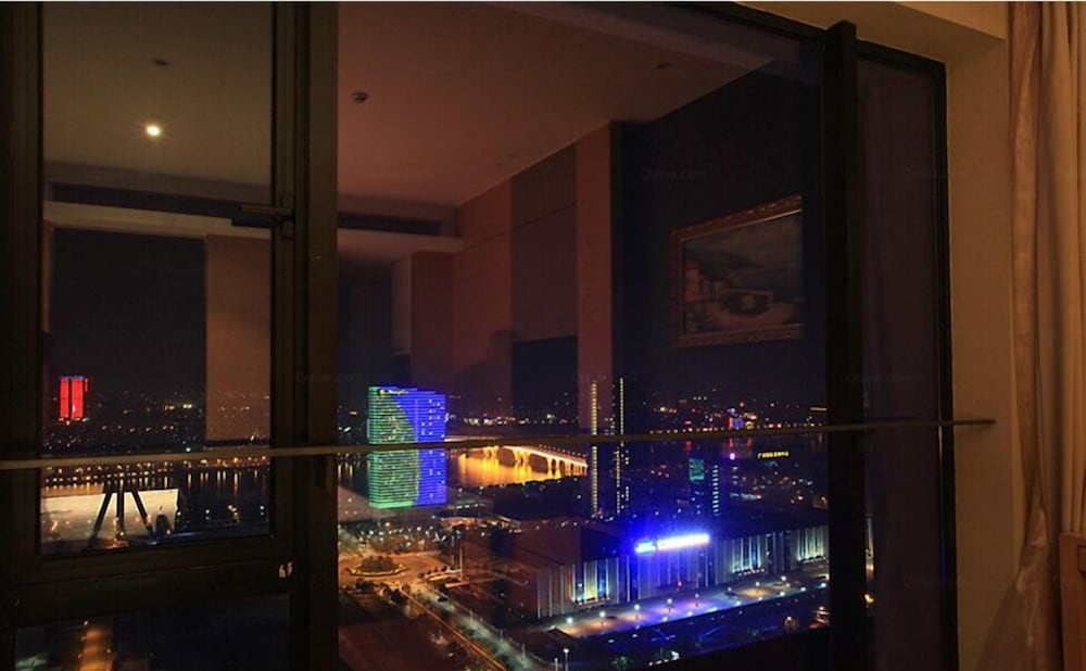 Фото Xingyi International Hotel Poly Store