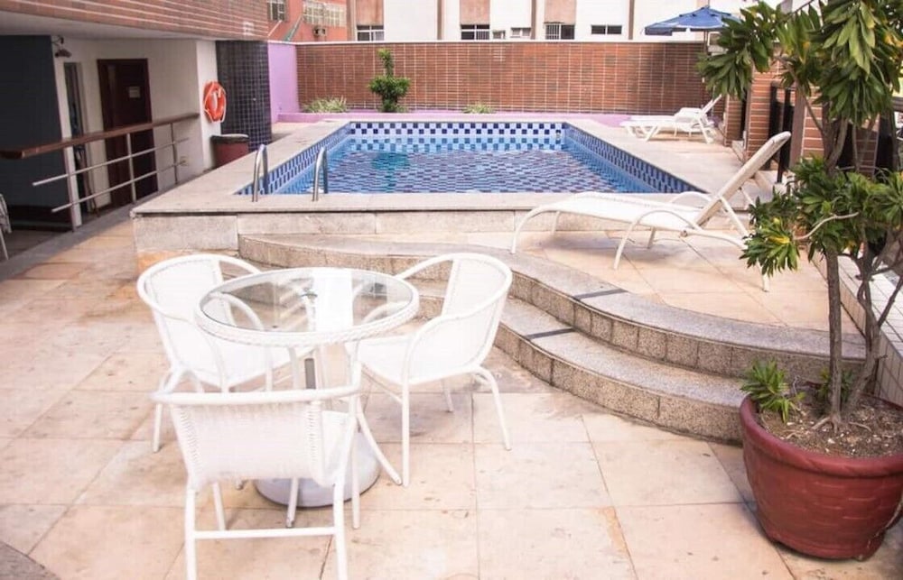 Фото Completo em Hotel Localização Perfeita