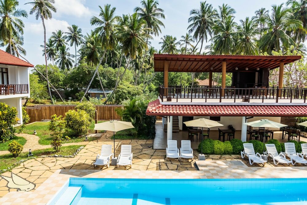 Фото Green Parrot Beach Resort