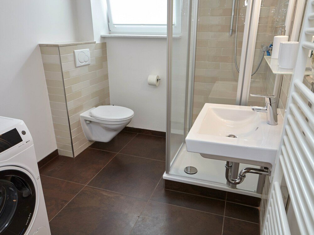 Фото Ferienhaus & Appartments Düneneck 8