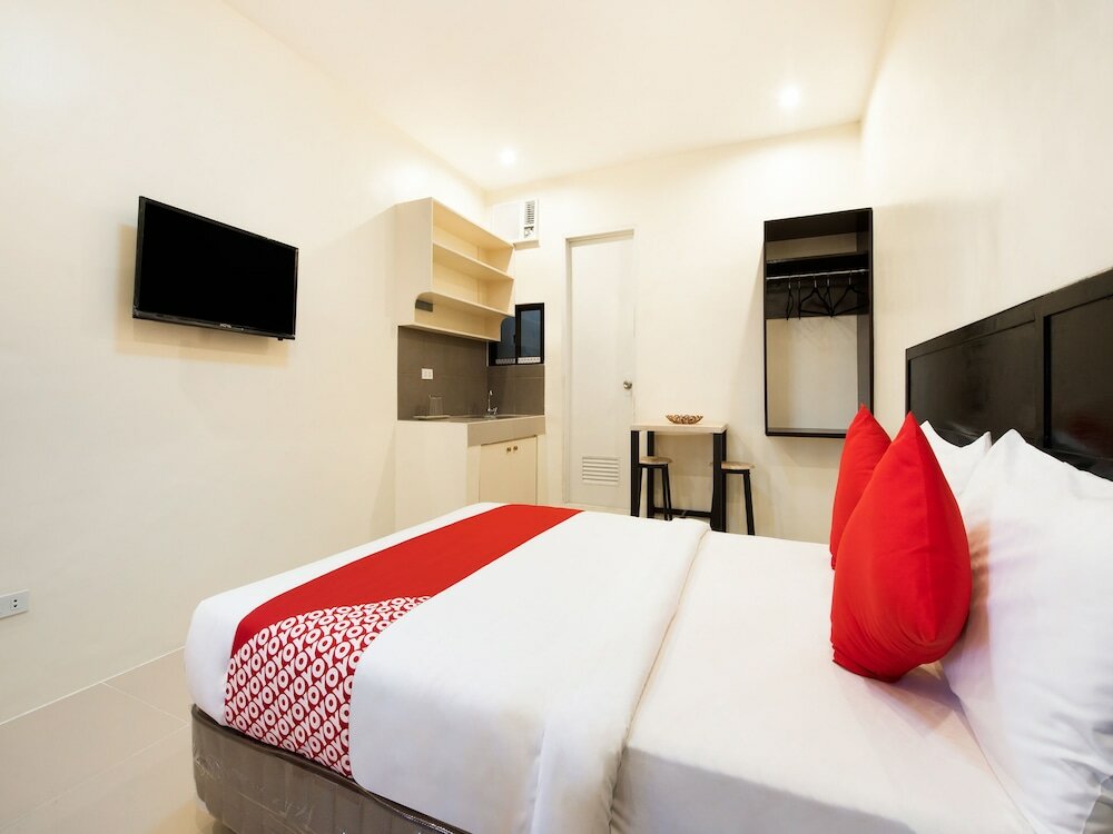 Фото Oyo 490 V-cat Apartelle