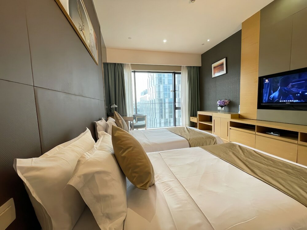 Фото Xingyi International Hotel Poly Store