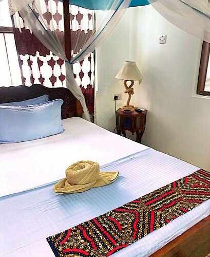 Гостиница 9 Dollar Hotel Zanzibar в Занзибаре