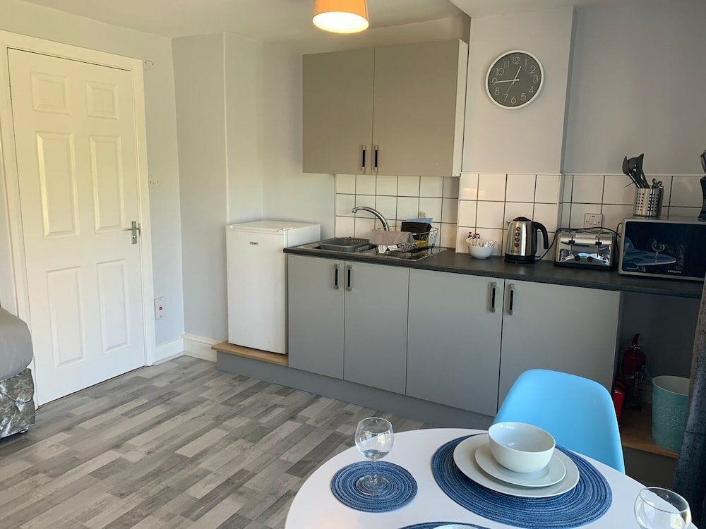 Фото Grey Stone Studio Apartments