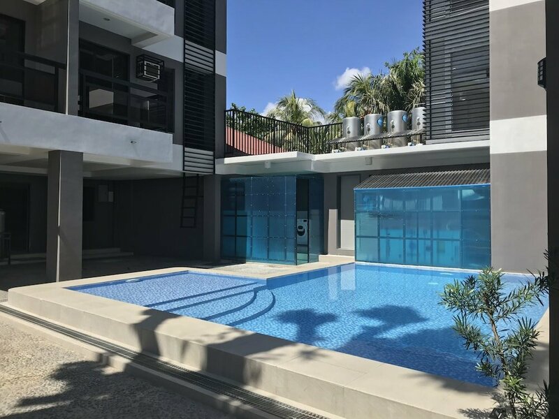 Гостиница Unwnd Residences Dumaguete в Думагете