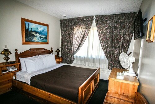 Гостиница Bighorn Inn & Suites