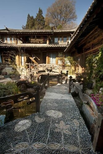 Гостиница Lijiang Taohuadao Post Inn