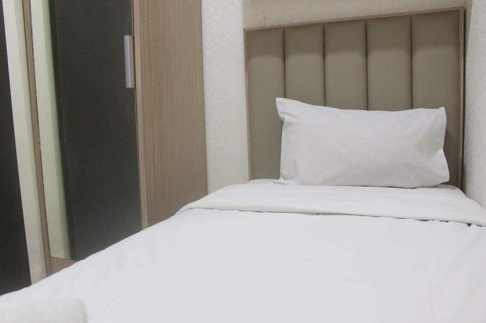 Фото Simple And Homey 2Br Apartment At Grand Asia Afrika