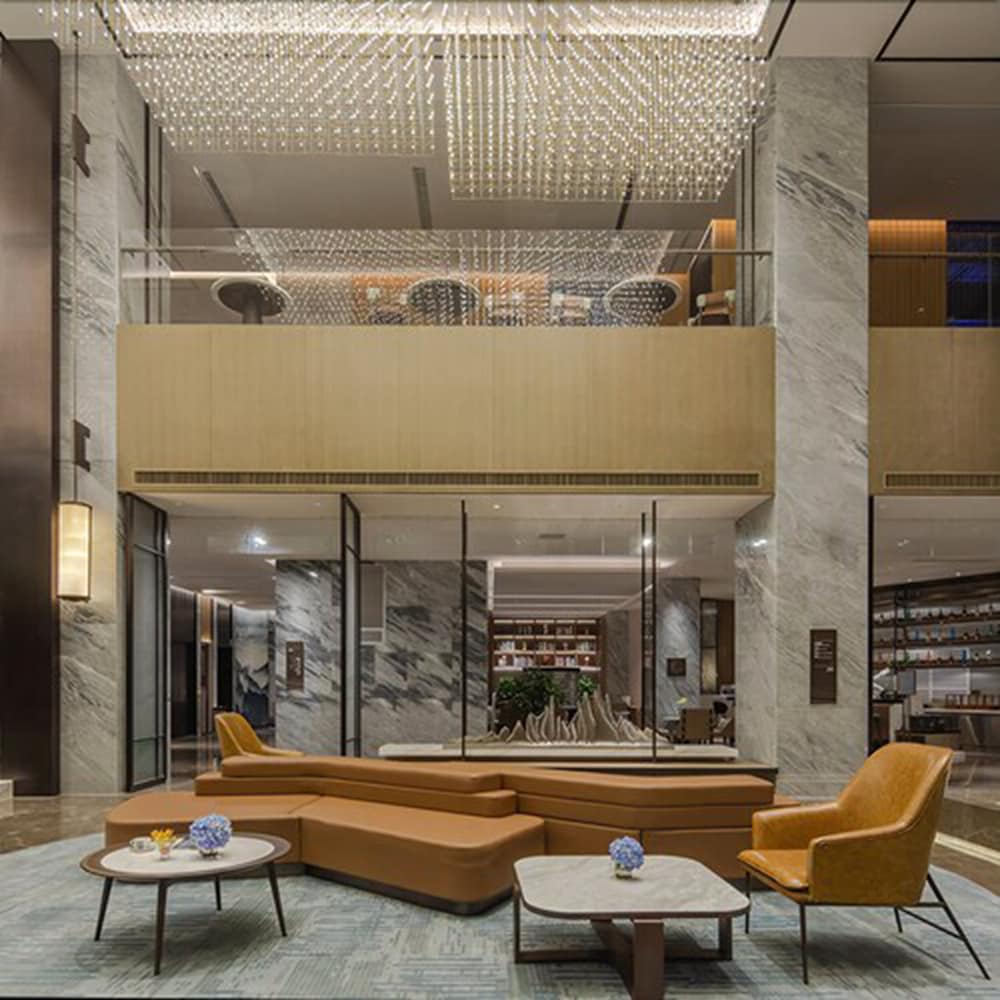 Фото New Century Hotel Zhenhai