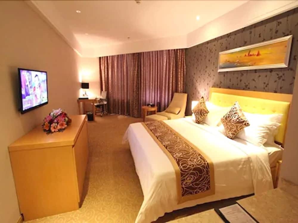 Фото New Beacon Xu Dong International Hotel