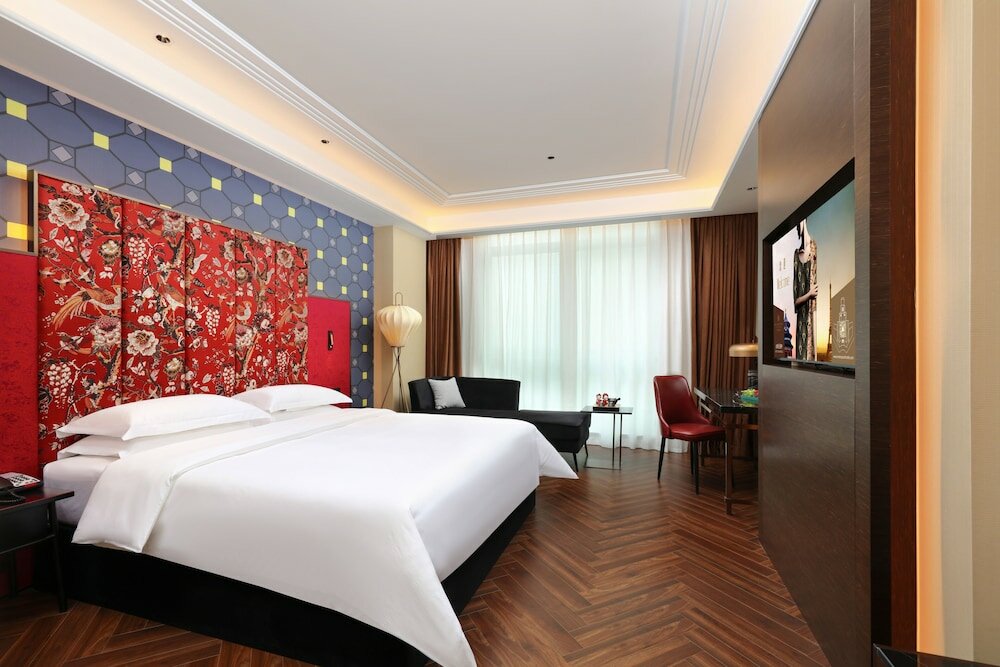 Фото Tiegang Jinjiangduchengjiudian