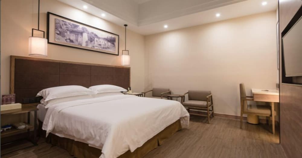 Фото Auden International Hotel