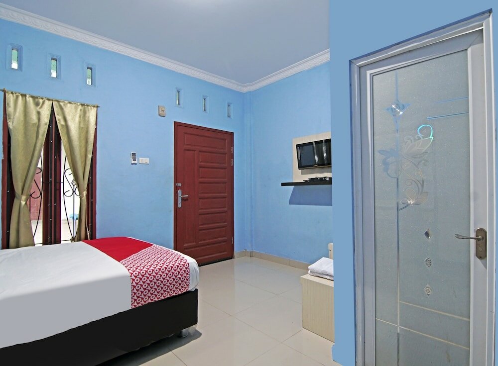 Фото Oyo 90752 Ridho Guest House Syariah