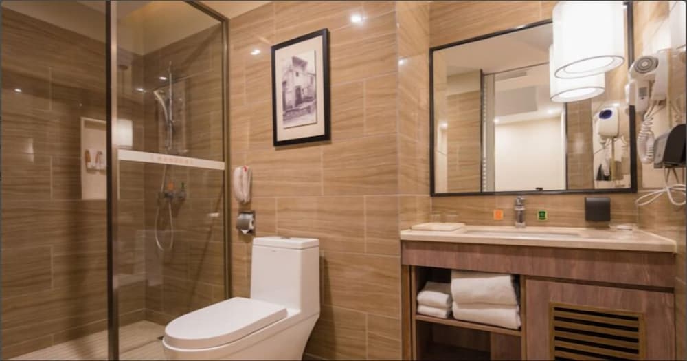 Фото Auden International Hotel