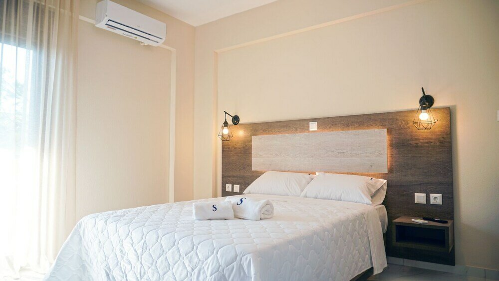 Фото Sinodinos Deluxe Apartments