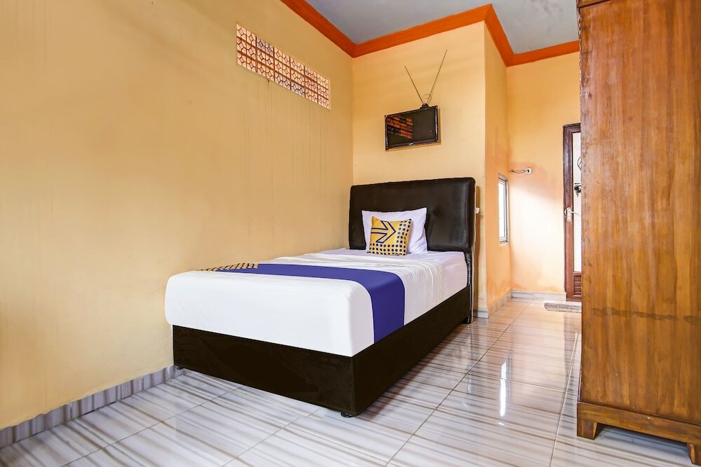 Фото Spot On 90433 Serasi Kost