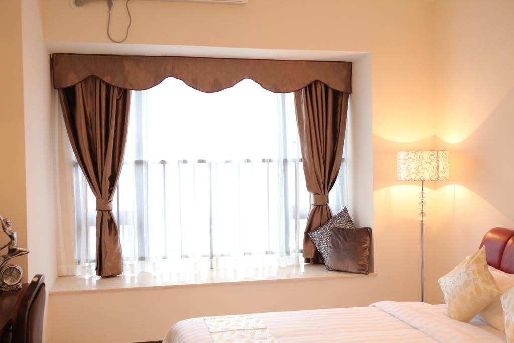 Фото Guangzhou Yi Long International Apartment