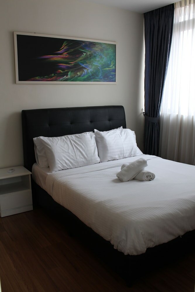 Фото Peaceful Service Suites at Taragon Puteri Bintang