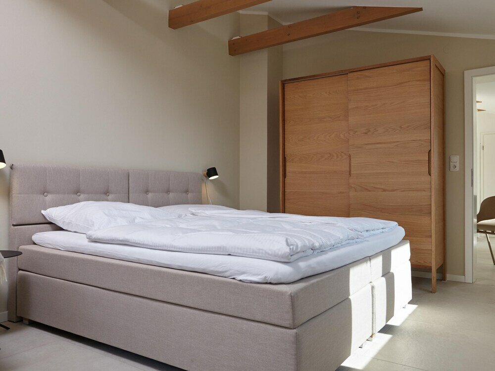 Фото Ferienhaus & Appartments Düneneck 8