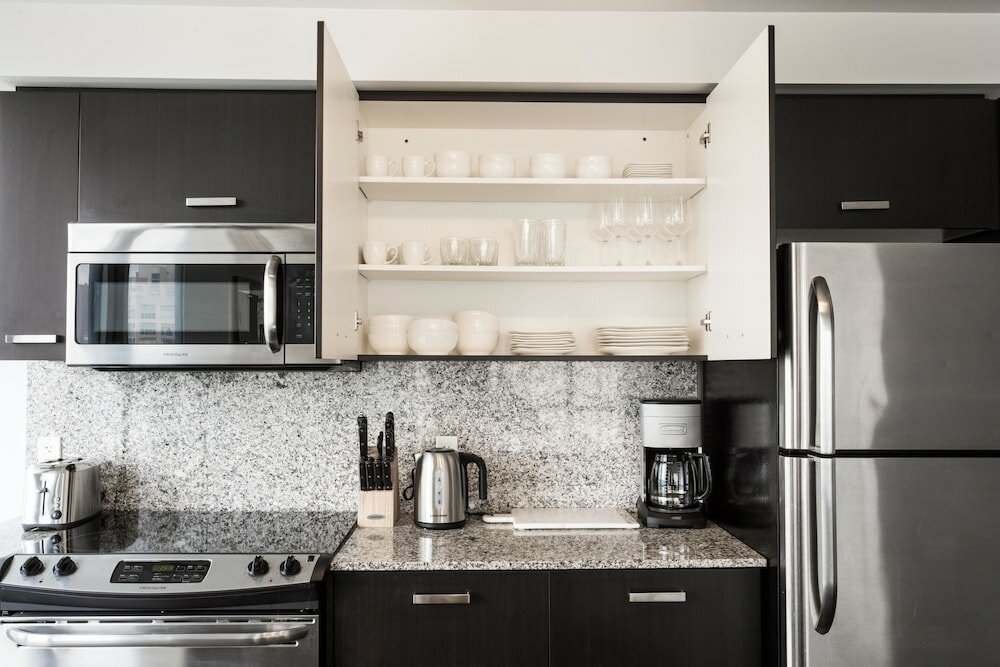 Фото Altitude Suites Bay Street by Teristo Group