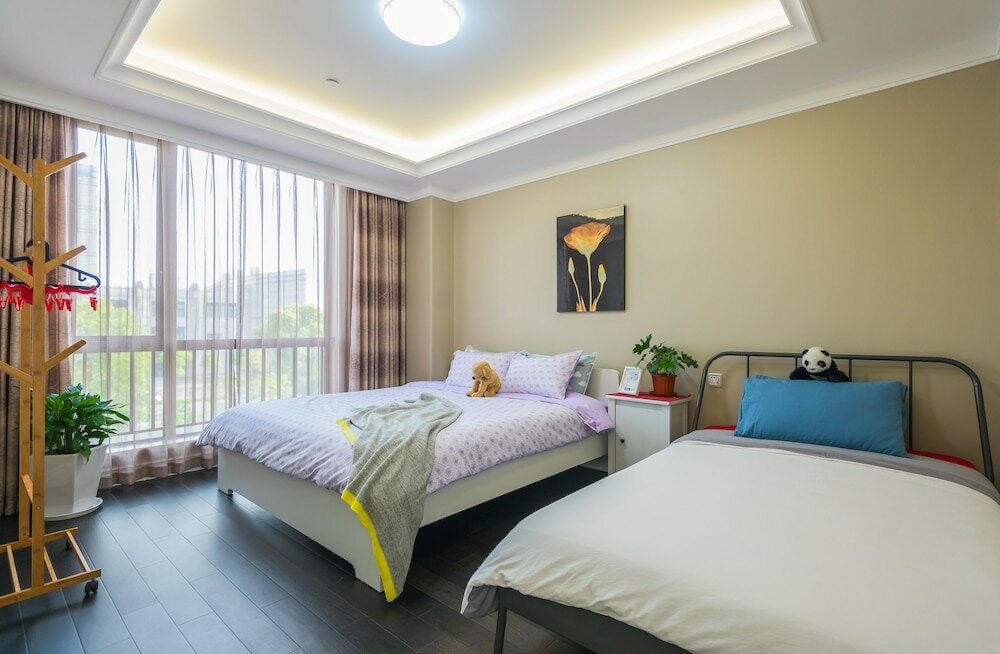 Фото Shanghai Xinchuan Boutique Apartment