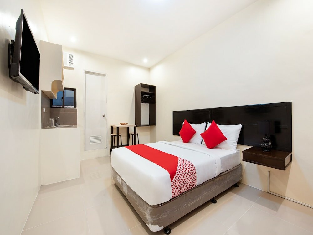 Фото Oyo 490 V-cat Apartelle