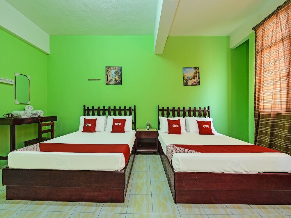 Фото Super Oyo Capital O 90659 Raintown Timbers Hotel