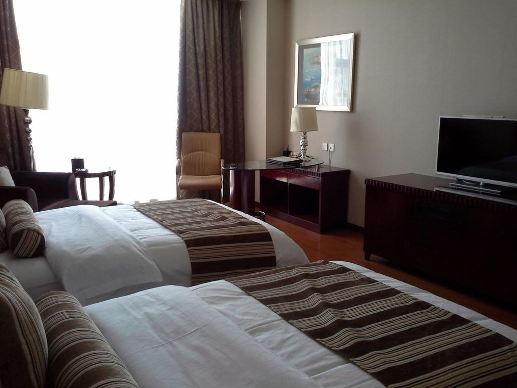 Фото Qingdao Huaxi Hotel