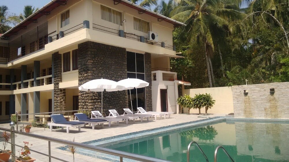 Фото New Kovalam Beach Hotel
