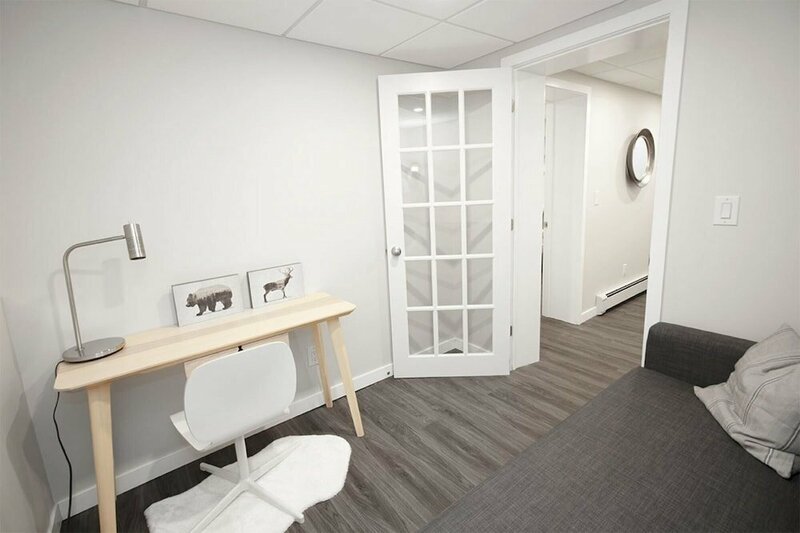 Гостиница Cozy One Bedroom in a Historic Home on the Assiniboine River Lower Level Unit With Den in Wolseley Parking Included в Виннипеге