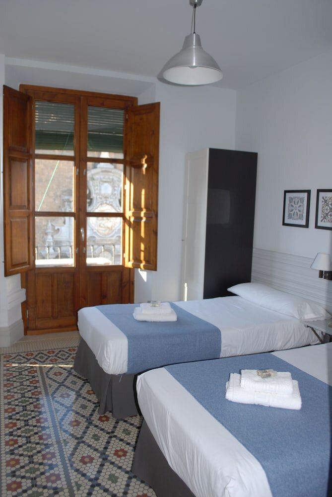 Фото La Perla Granada Suites