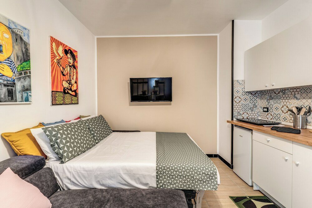 Фото The Quarters Naples Apartment