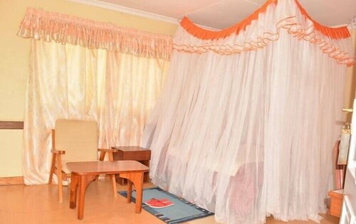 Гостиница Racecourse Inn Hotel в Элдорете