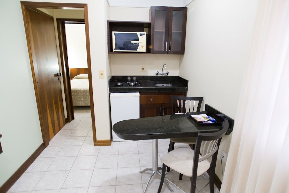 Фото Le Village Flats Hotel e Business