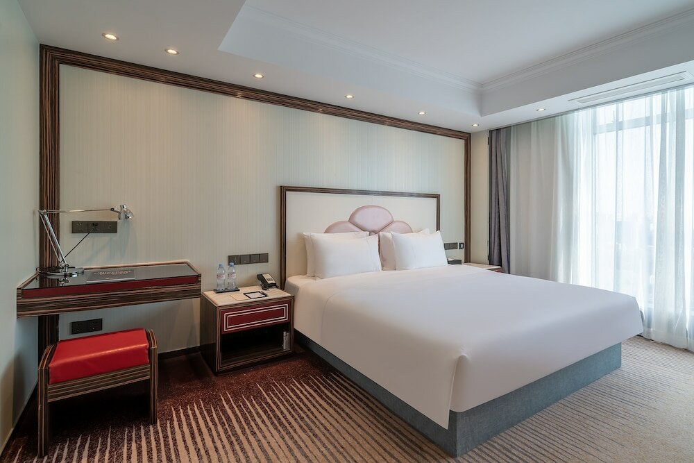 Фото Suning Universal Hotel All-Suites