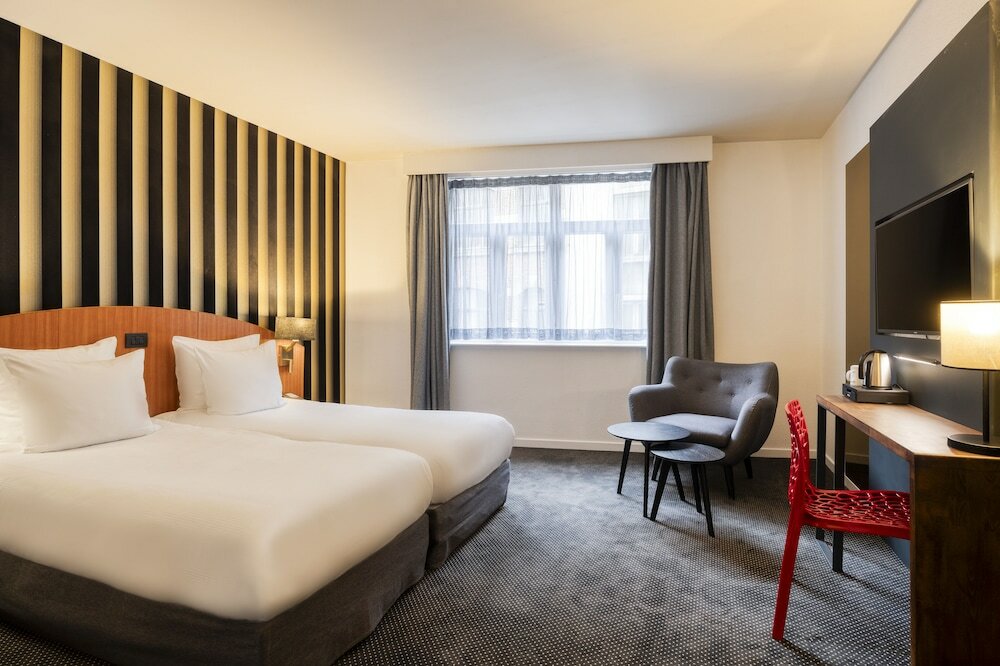 Фото Aris Grand-Place Hotel