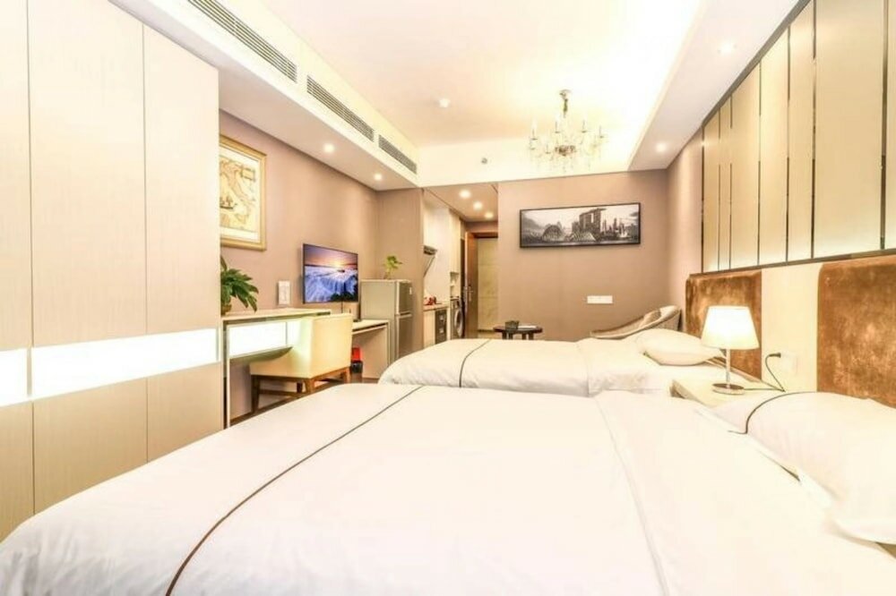 Фото BaiHe International Apartment Hotel