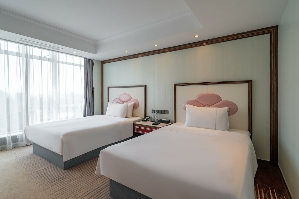 Фото Suning Universal Hotel All-Suites